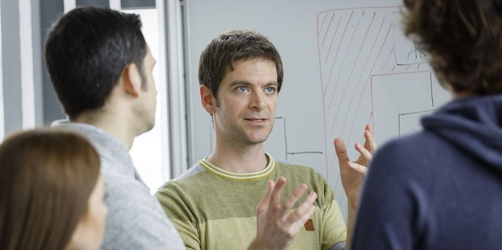 Vector employees discuss together