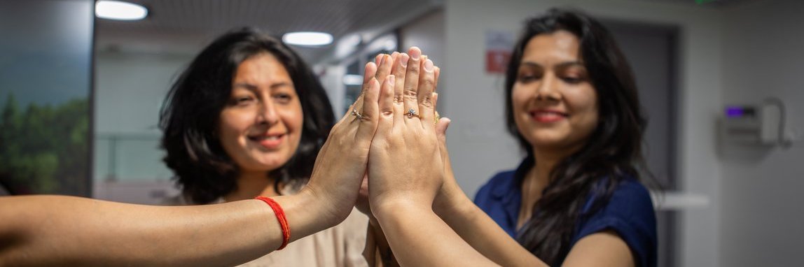 Vector employees give each other a high-five