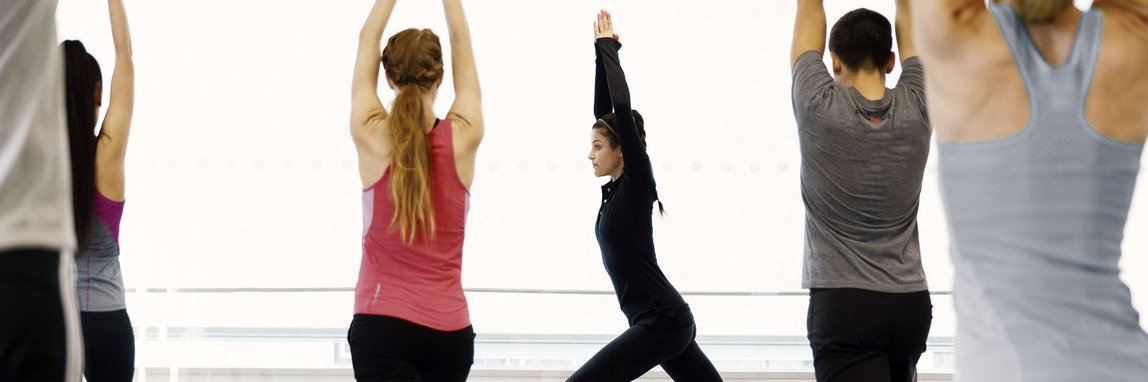 Vector employees at a yoga course