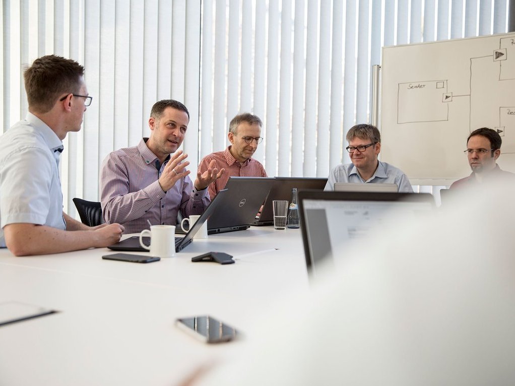 Vecor employees in a discussion