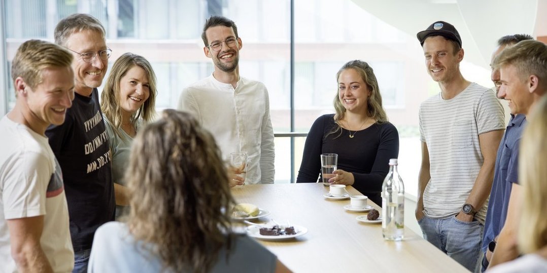 Vector employees during a conversation in the coffee kitchen