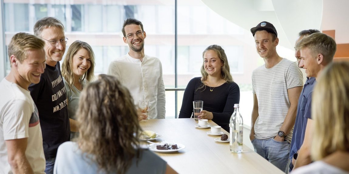 Vector employees during a conversation in the coffee kitchen