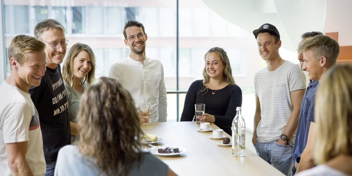 Vector employees during a conversation in the coffee kitchen