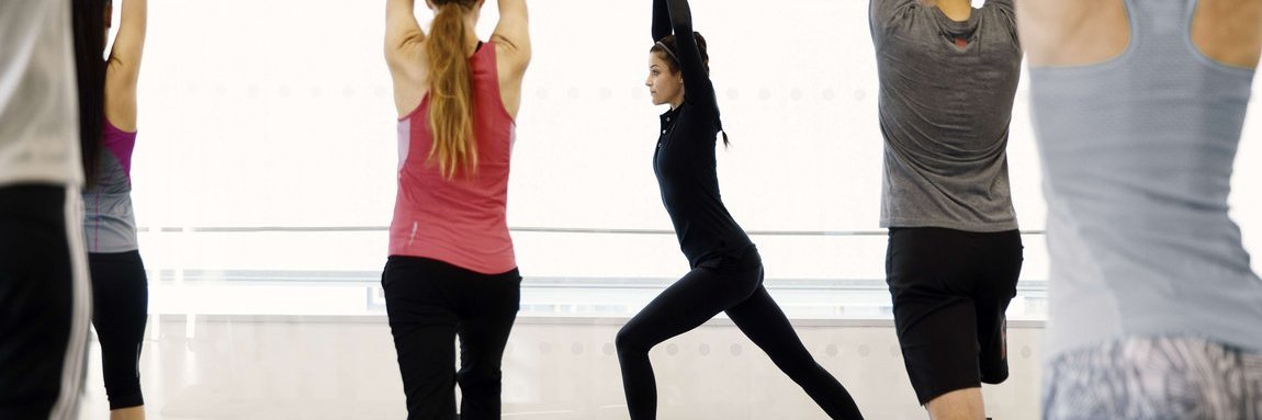 Vector employees at a yoga course