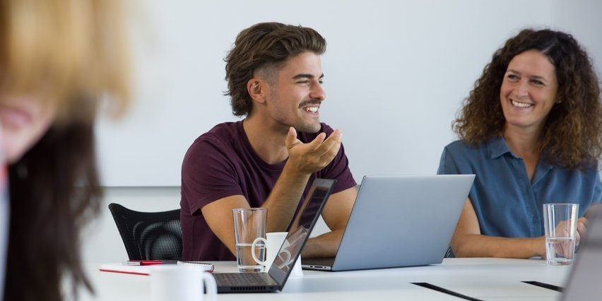Employees laughing in a meeting