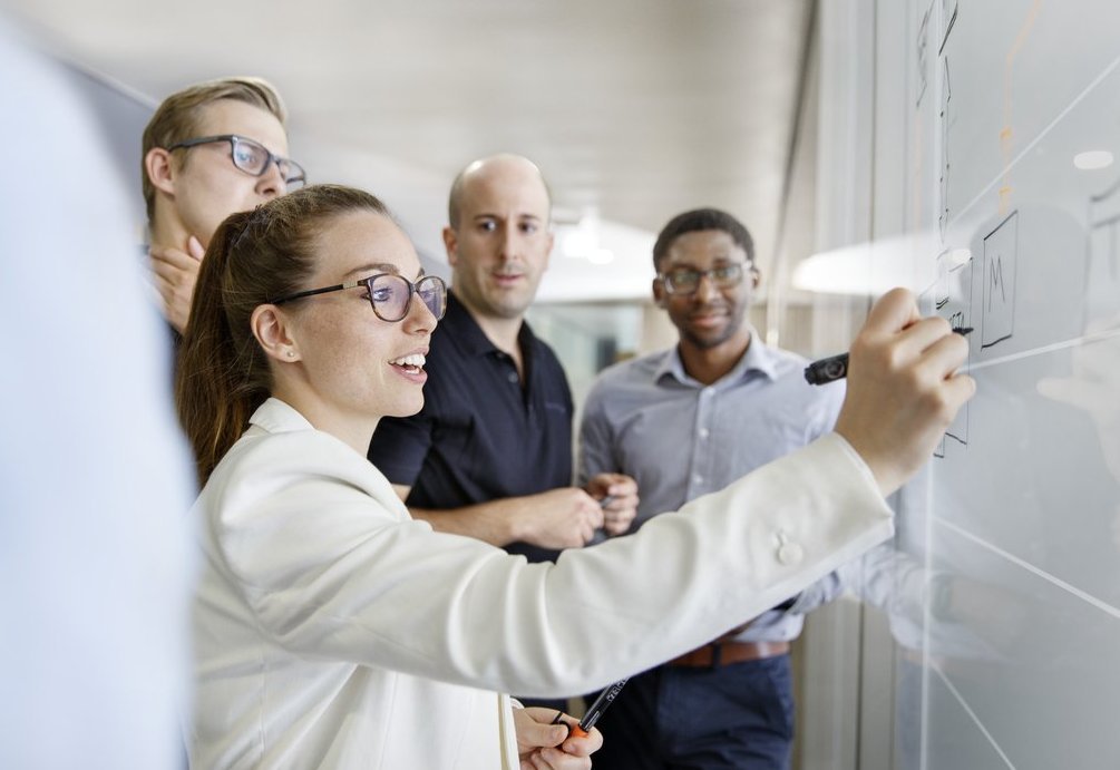 Vector employees during a team brainstorming activity 