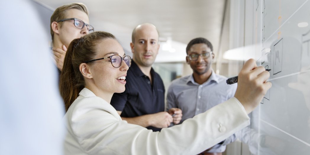 Vector employees in a productive discussion