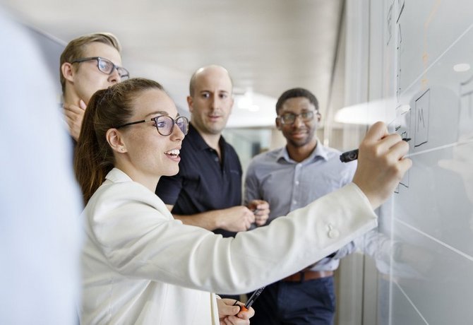 Vector employees during a team brainstorming activity 