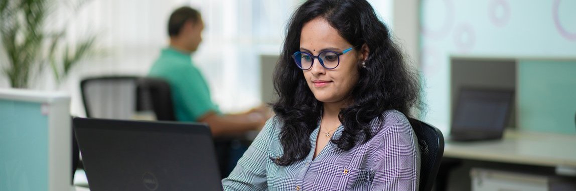 A Vector employee working at her workplace