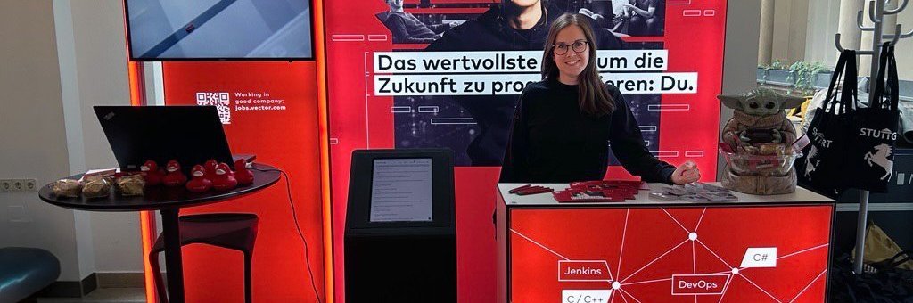 Vector exhibition stand with basic color red, monitor and counter at a university event.
