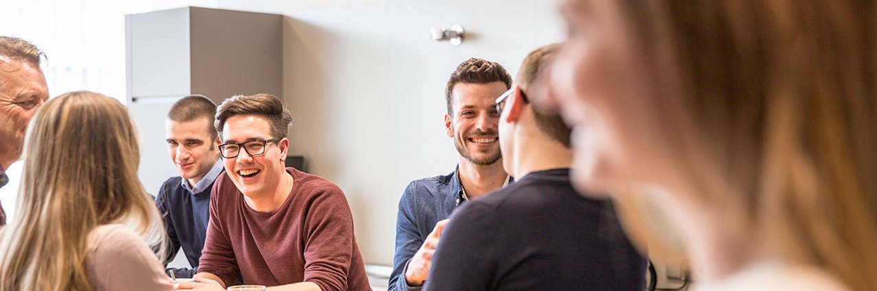 Vector employees chat in the coffee kitchen