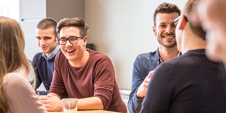 Vector employees during a conversation in the coffee kitchen
