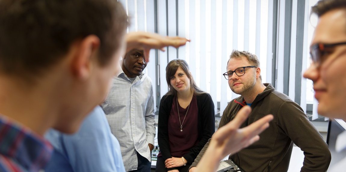 Vector employees in a meeting