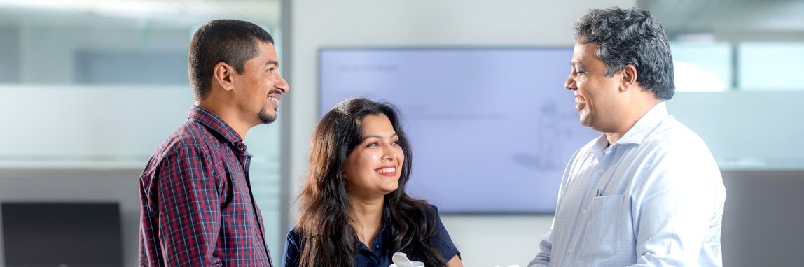Vector employees during a conversation in the coffee kitchen