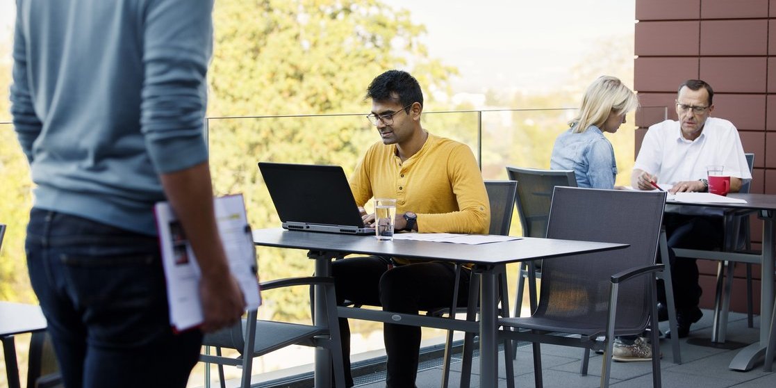 Vector employees work on the terrace in Regensburg